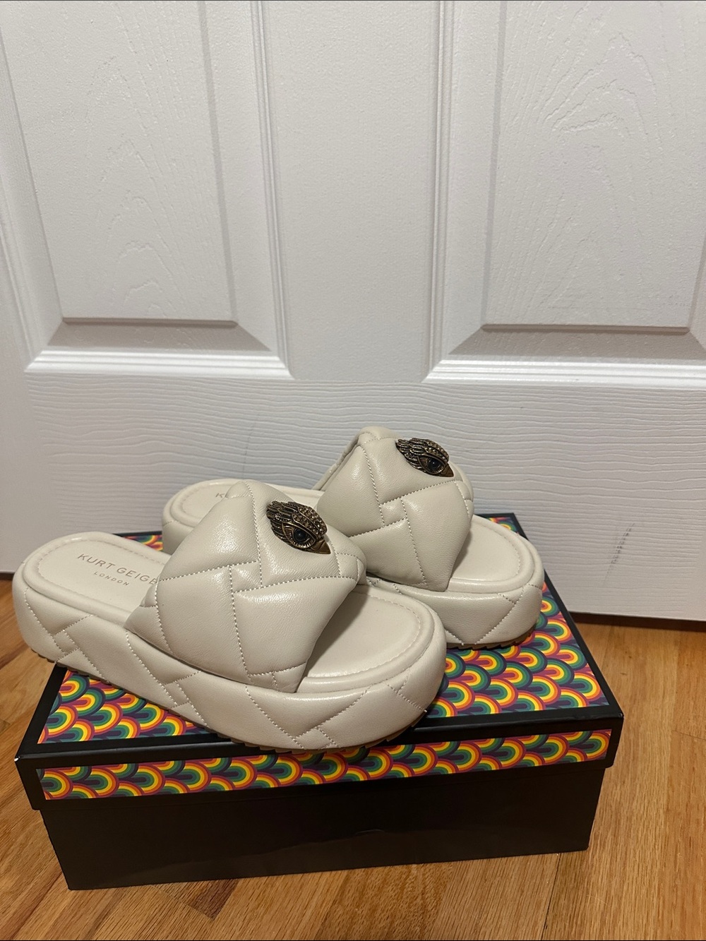 Kurt Geiger Cream Quilted Platform Slide Mules with Decorative Medallion